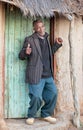 Happy senior in front of a shack Royalty Free Stock Photo