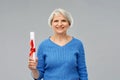 Happy senior graduate student woman with diploma