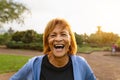 Happy senior Latin woman having fun smiling on camera after training activity in a public park Royalty Free Stock Photo