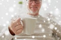 Happy senior man with cup of tea or coffee at home Royalty Free Stock Photo