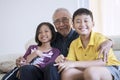 Happy senior man and grandchildren smiling Royalty Free Stock Photo