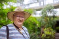 Happy senior man relaxing in park through the trees Royalty Free Stock Photo