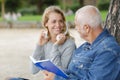 happy senior man with smiling daughter in park Royalty Free Stock Photo