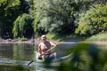 Senior man rowing in boat on river Royalty Free Stock Photo