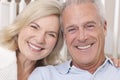 Happy Senior Man & Woman Couple Smiling at Home