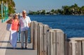 Happy Senior Man Woman Couple Walking Tropical Sea or River Royalty Free Stock Photo