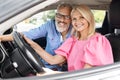 Happy senior man and woman posing together in car Royalty Free Stock Photo