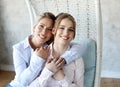 Happy senior mother embracing adult daughter laughing together Royalty Free Stock Photo