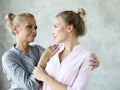 Happy senior mother embracing adult daughter laughing together, smiling excited aged older lady hugging young woman Royalty Free Stock Photo