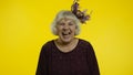 Happy senior old woman laughing out loud after hearing anecdote, funny joke, positive lifestyle Royalty Free Stock Photo
