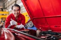 Happy senior professional Asian male mechanic garage worker happy working replace maintenance car service in auto workshop