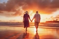 Happy senior retired couple walking a beach