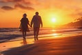 Happy senior retired couple walking a beach