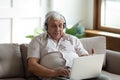 Modern senior man talk on video call on laptop Royalty Free Stock Photo