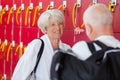 happy senior talking in fitness club locker room Royalty Free Stock Photo