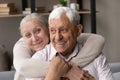 Happy senior wife piggyback pensioner husband smile look at camera Royalty Free Stock Photo