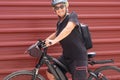 Happy senior woman cyclist in outdoor excursion in urban city. Elderly people ejoying healthy lifestyle Royalty Free Stock Photo
