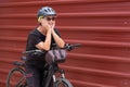 Happy senior woman cyclist in outdoor excursion in urban city. Elderly people ejoying healthy lifestyle Royalty Free Stock Photo