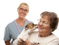 Happy Senior Woman with Dog and Veterinarian Royalty Free Stock Photo