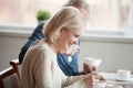 Happy senior woman having breakfast with aged husband at home Royalty Free Stock Photo