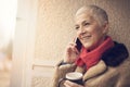Happy senior woman having a pleasant phone call Royalty Free Stock Photo
