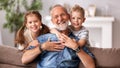 Happy senior woman hug grandkids Royalty Free Stock Photo