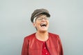 Happy senior woman laughing outdoor - Trendy mature person having fun during retired time