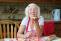 Happy senior woman making cookies at the kitchen Royalty Free Stock Photo