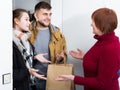 Happy senior woman meeting daughter with husband