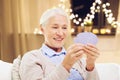 Happy senior woman playing cards on christmas Royalty Free Stock Photo