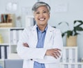 Happy senior woman, portrait and doctor with arms crossed in confidence for healthcare at the office. Excited, confident Royalty Free Stock Photo