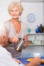 Happy senior woman pouring tea Royalty Free Stock Photo