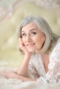 Happy senior woman sitting near dressing table Royalty Free Stock Photo