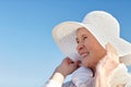 Happy senior woman in sun hat on summer beach Royalty Free Stock Photo