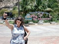 Happy Senior Woman Taking a Selfie on Caribbean Vacation