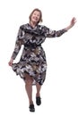 Happy senior woman wearing dress dancing with hands raised Royalty Free Stock Photo