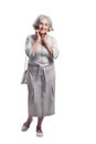 Happy senior woman wearing light dress posing isolated Royalty Free Stock Photo