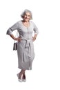 Happy senior woman wearing light dress posing isolated Royalty Free Stock Photo