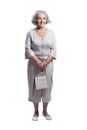 Happy senior woman wearing light dress posing isolated Royalty Free Stock Photo