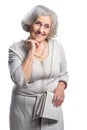 Happy senior woman wearing light dress posing isolated Royalty Free Stock Photo