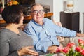 Happy seniors couple sitting on the couch at home Royalty Free Stock Photo