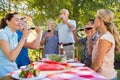 Happy seniors toasting with their family Royalty Free Stock Photo