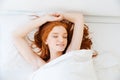 Happy sensual woman lying and relaxing in bed Royalty Free Stock Photo