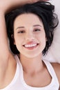 Happy sensual young woman lying in bed Royalty Free Stock Photo