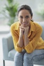 Happy serene woman posing at home