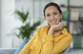 Happy serene woman posing at home