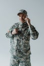 happy serviceman in army uniform talking