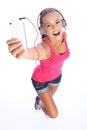 Happy teenage girl has music fun with phone Royalty Free Stock Photo