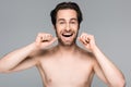 happy and shirtless man flossing teeth Royalty Free Stock Photo