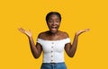 Happy Shock. Emotional African Lady Exclaiming With Excitement At Camera, Yellow Background